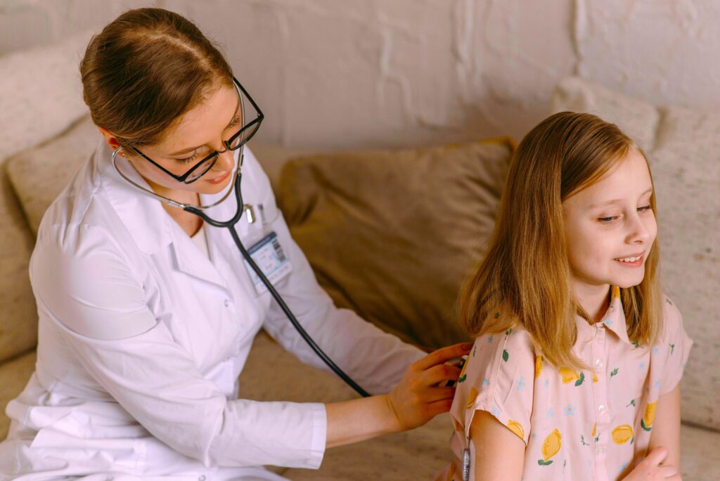 female doctor examining a girl